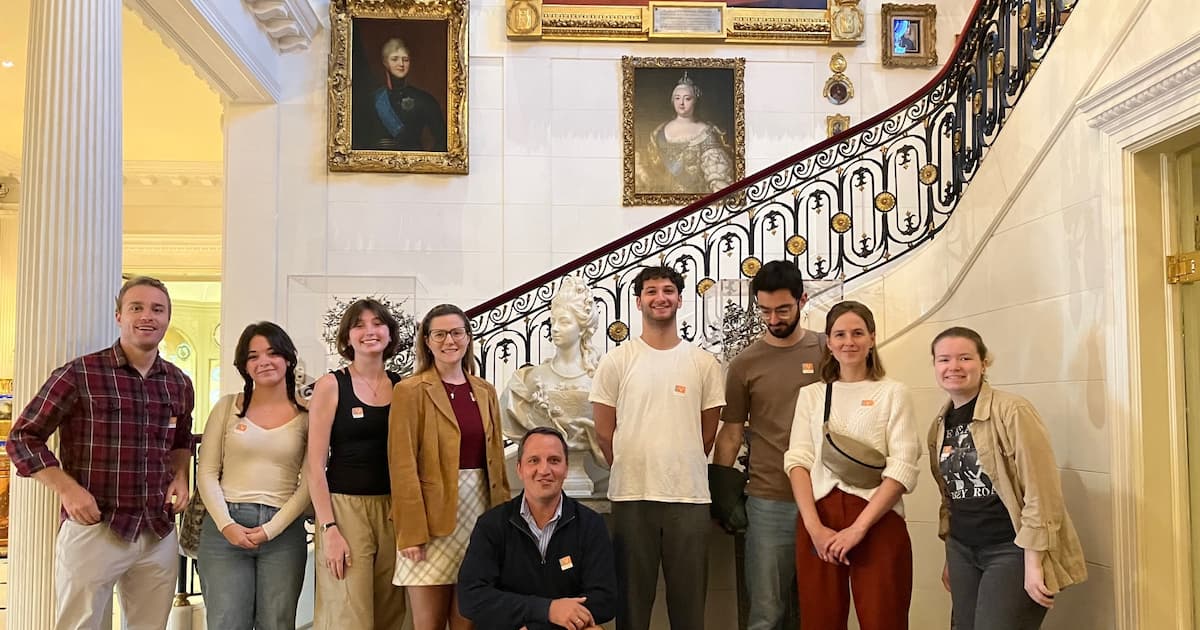 Tour group in the Hillwood Museum foyer, covered in paintings and objets d'art