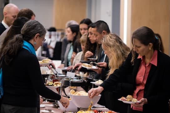 Guests help themselves to delicious Russian foods.