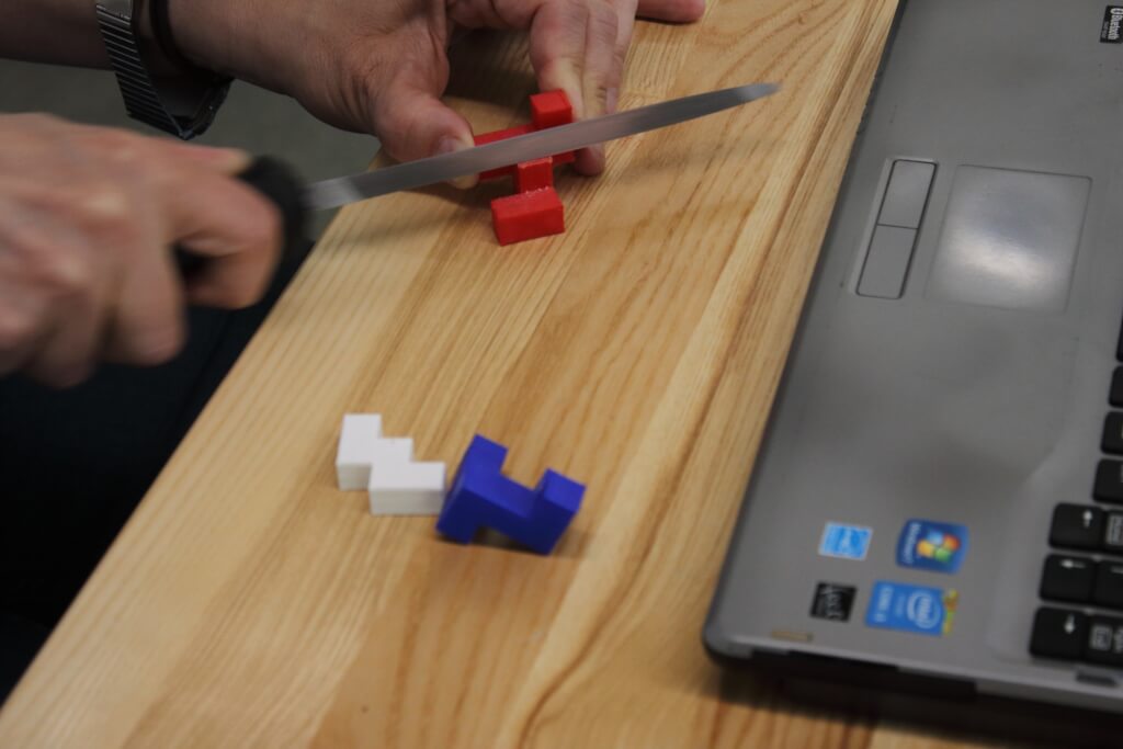 filing the edges of the red puzzle piece