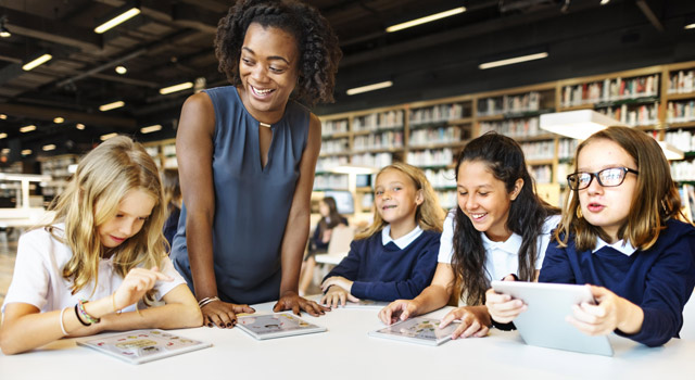 Teacher with students.