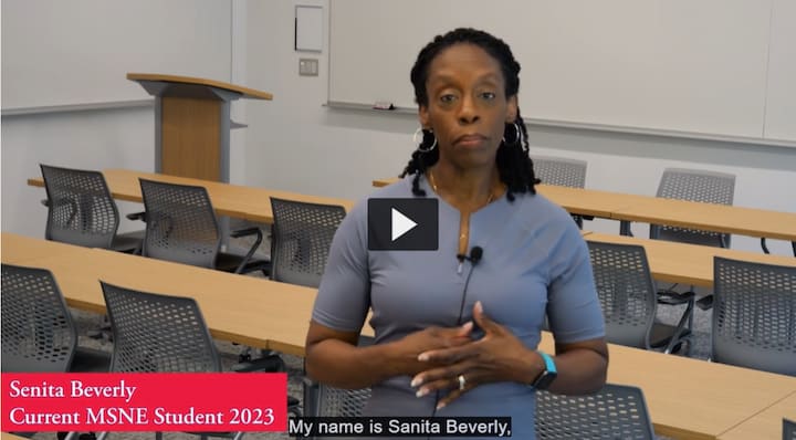 AU Alum Sanita Beverly speaking in a classroom.