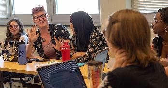 AU graduate students in discussion during class