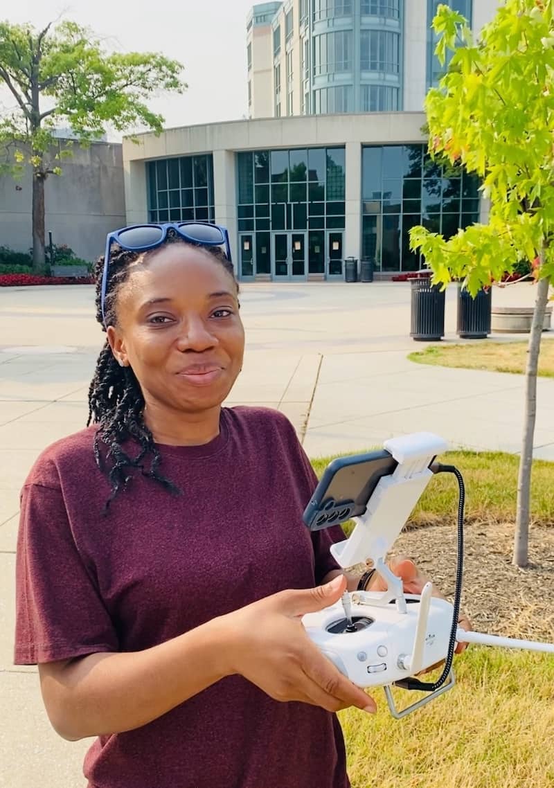 Glory Iorliam collecting tree measurements at UMBC