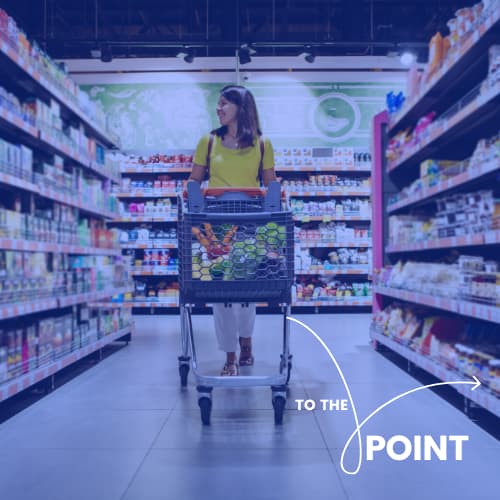 To the Point. Woman pushing cart through grocery store aisle.