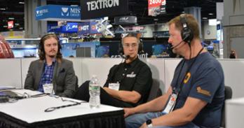 Vic Ruble (center) conducting an interview at the Modern Day Marine Expo