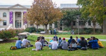 A class on the quad in front of Battelle-Tompkins Memorial Building