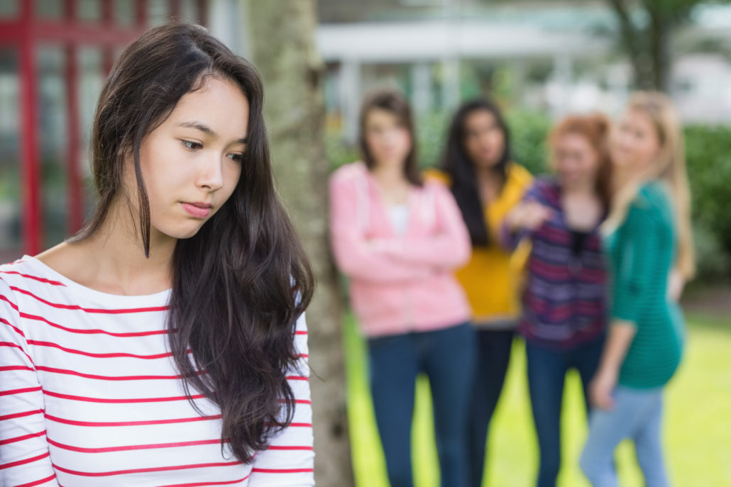 Teens bullying a peer