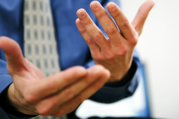 A man gestures with his hands