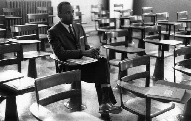 James Meredith seated in a classroom