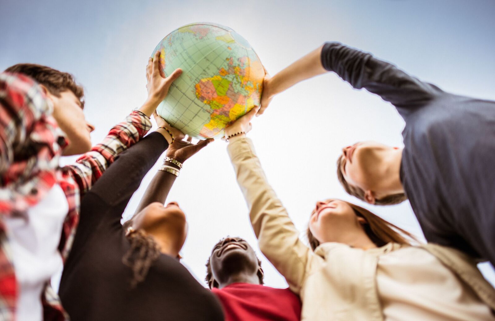 Hands holding a globe