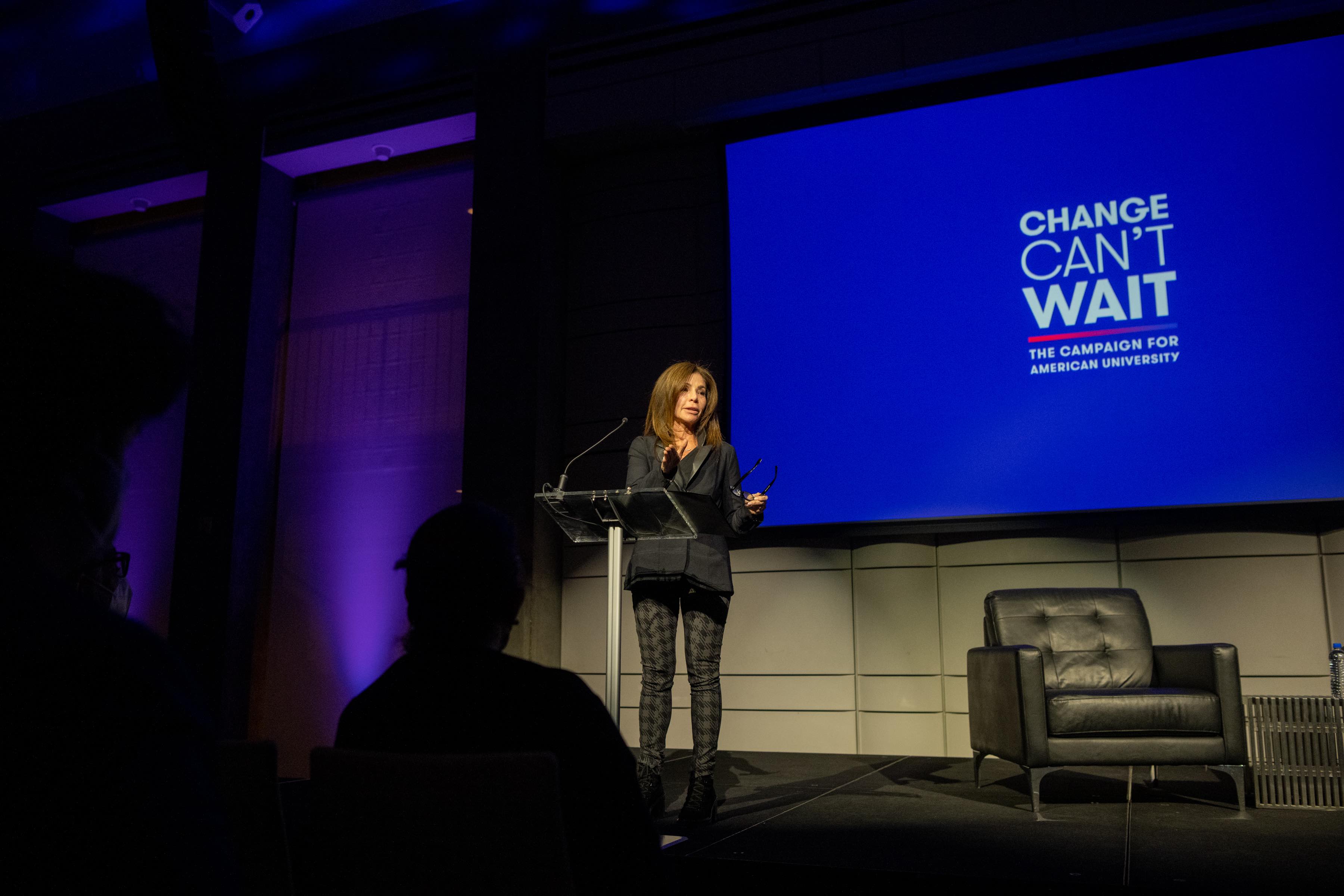 Jill Black delivers a speech at a podium at a Change Can't Wait event