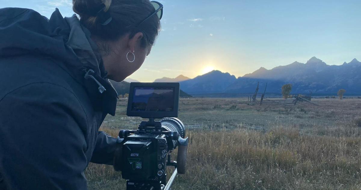 Photographer sets up shot across horizon