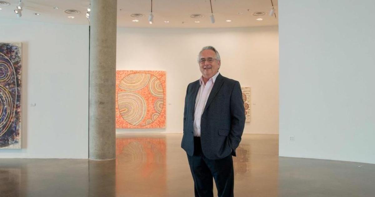 Jack Rasmussen standing among artworks in the AU Museum in Katzen Performing Arts Center.