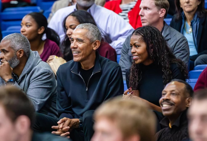 Barack and Michelle Obama in attendance at Bender Arena for the AU-Harvard men's basketball game