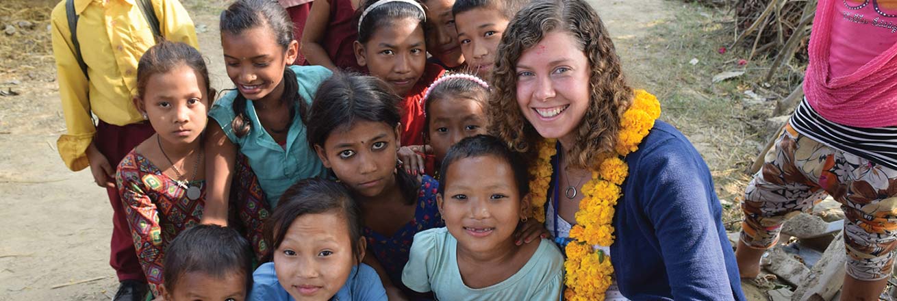 American University Master of Public Administration student with group of children