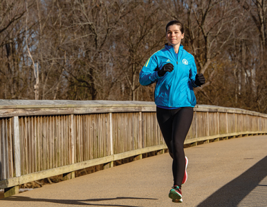 Mara Gramling runs on the bridge to Theodore Roosevelt Island