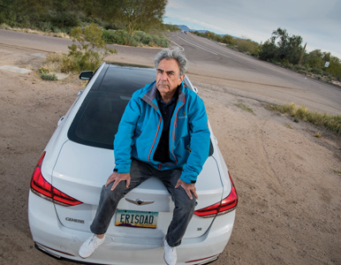 Barry Kluger sits on his car in Scottsdale, Arizona