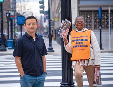 Will Schick and a Street Sense vendor