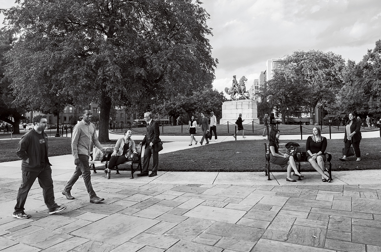 alumni conversing in Washington Circle Park