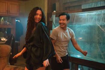 Trieu Tran dances near a fish tank as Sharko in Monsterland