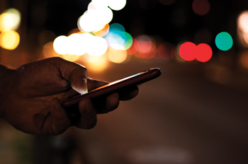 Person holding phone that indicates their ride has been canceled