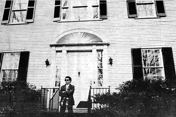 African American student with arms crossed outside the President's Office Building