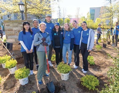 AU President Sylvia Burwell with Campus Beautification volunteers