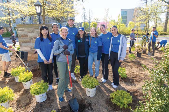 AU President Sylvia Burwell with Campus Beautification volunteers