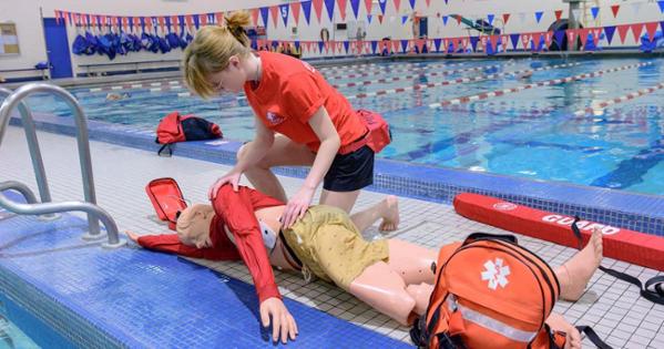 Teagan Odders demonstrates life-saving practices on Wet Eddie. Photo by Jeff Watts. 