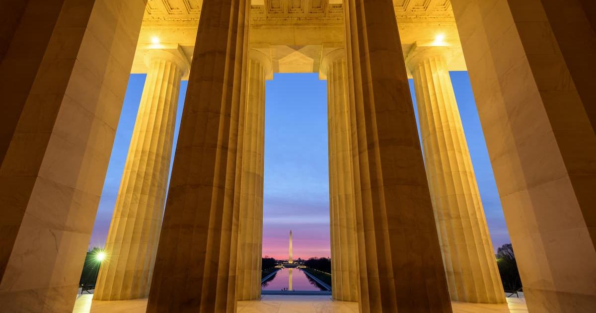 Washington Monument through the columns of the Lincoln Memorial 