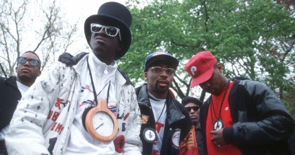 Rapper Flavor Flav, director Spike Lee, and Chuck D of Public Enemy film a video for their song, 