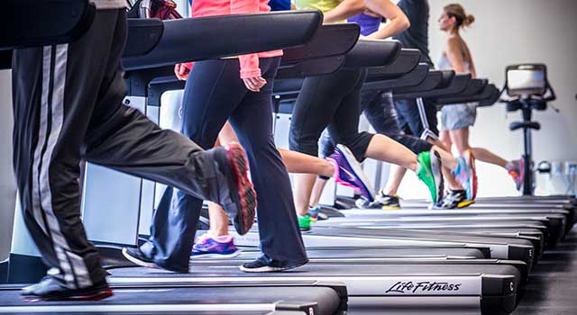 Students workout on treadmills