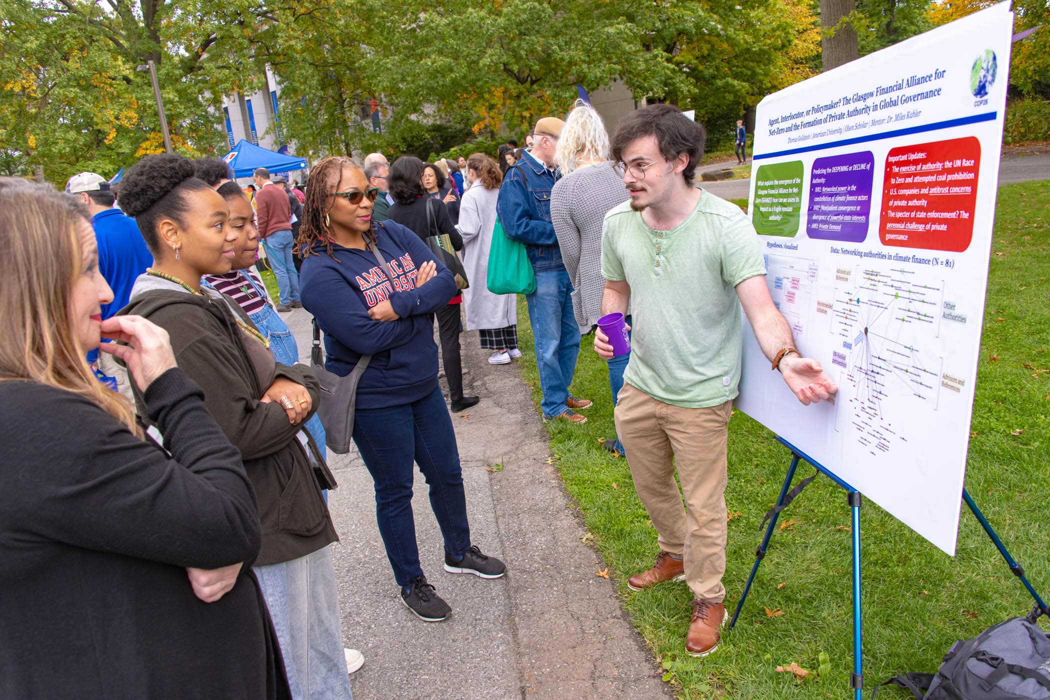 A student presenting to a group of people