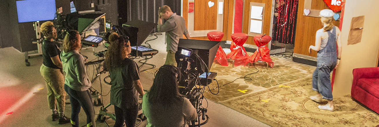 Students film on a tv set