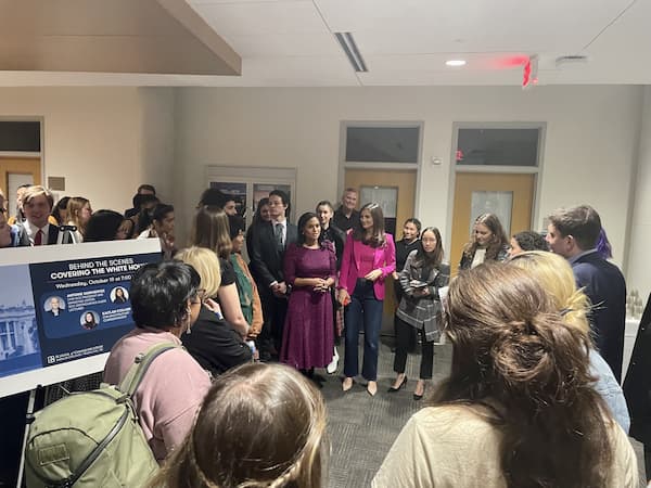 Kristen Welker and Kaitlan Collins talking with students after the event