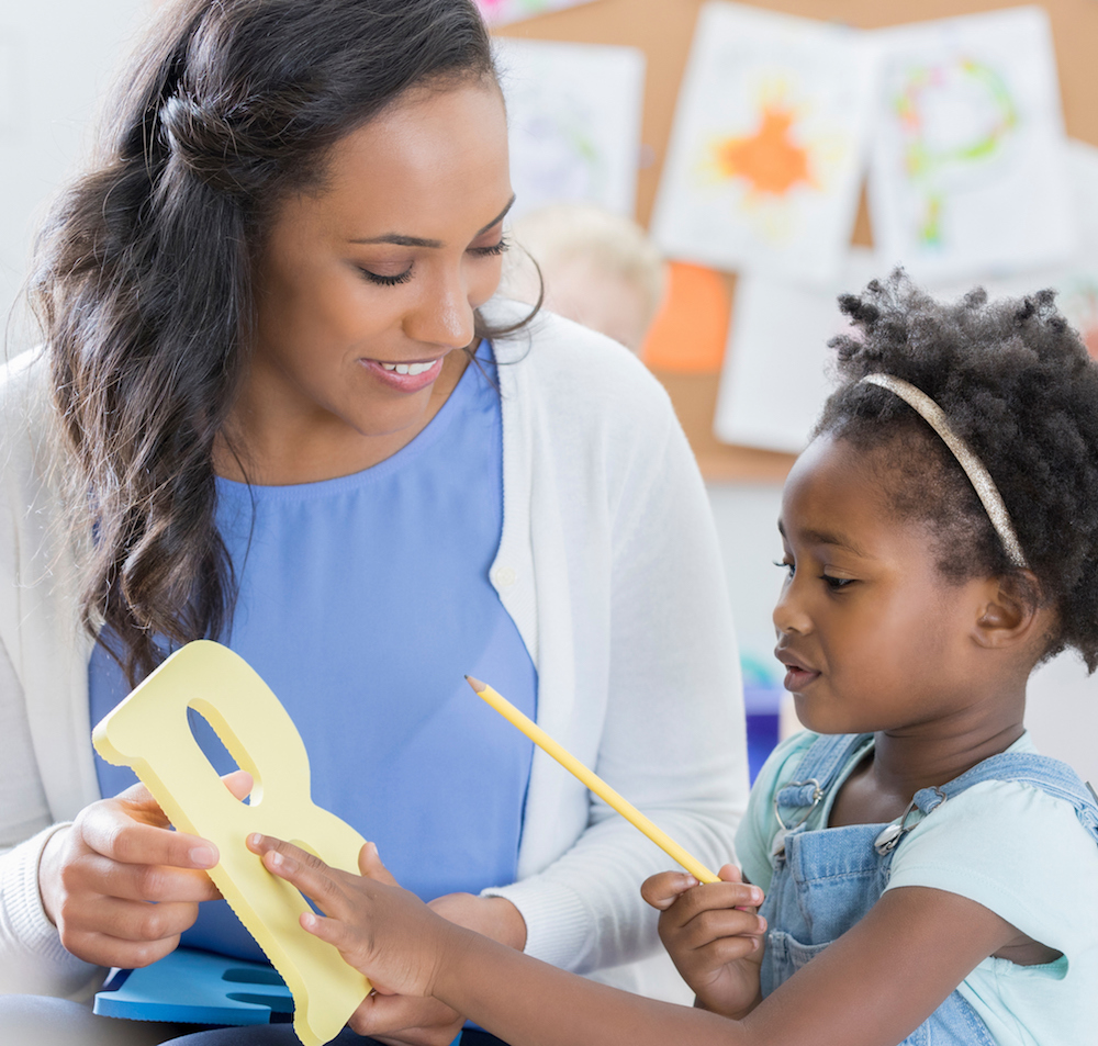 Teacher and Girls with letter B