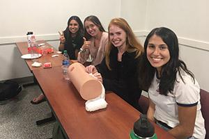 Four students at the Stop the Bleed event