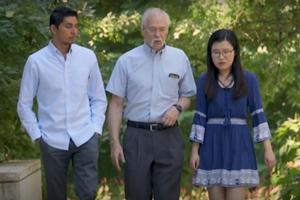 Ken Meier talks with students outside Kerwin Hall.