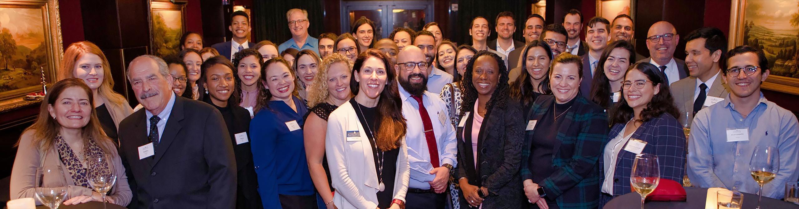 Laura Herr ’03 and Dean Camille Nelson are joined by alumni and admitted students at AUWCL’s Miami reception on March 3, 2020